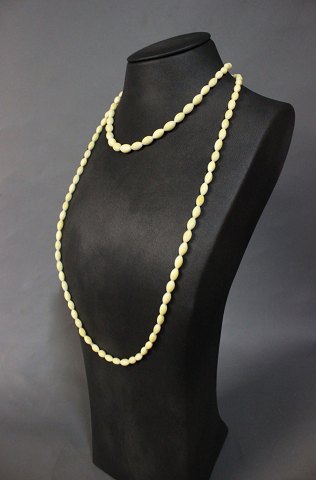 Long necklace made from Ivory from the 1960s.
5000m2 showroom. 
