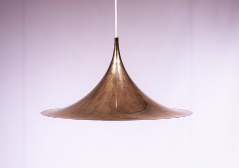 Gold colored Gubi Semi pendant designed by Claus Bonderup and Thorsten Thorup in 
1968. 
5000m2 showroom.