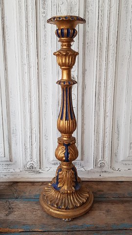 Beautiful old French candle stick in gilded wood 73 cm.