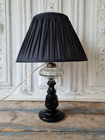 Beautiful 1800s black opaline lamp with oil container in clear glass with olive 
sanding.