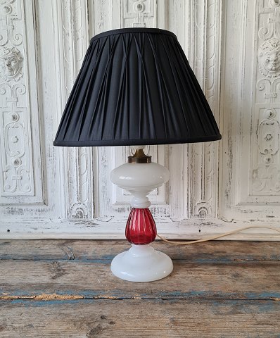 1800s white opaline lamp with stem in raspberry colored glass.
