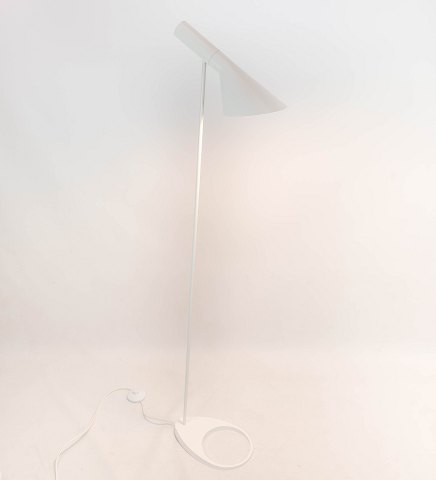 White floor lamp designed by Arne Jacobsen and manufactured by Louis Poulsen. 
5000m2 showroom.