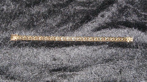 Panser Armbånd 14 karat guld
Stemplet BRP 585
Længde 17,3 cm
Brede 7,68 mm
Tykkelse 2,46 mm