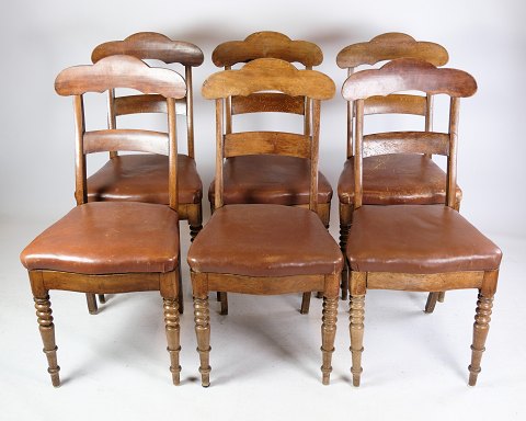 A set of eight late empire chairs in high quality brown leather in mahogany from 
around the year 1840s.
Dimensions in cm: H: 93 W: 44 D: 40 SH: 47
Great condition
