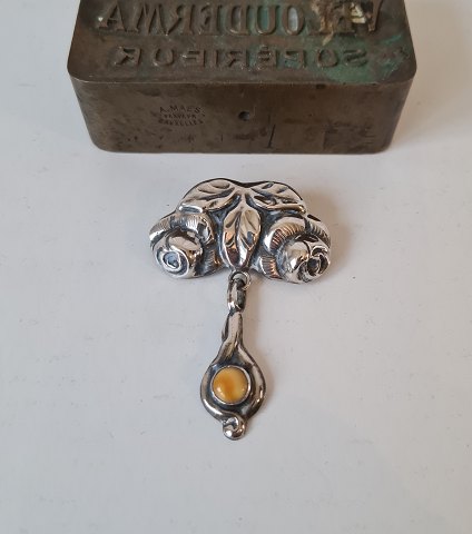 Vintage silver brooch in the shape of roses with amber pendant