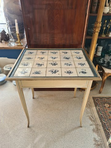 1800s gray painted tile table with 1800s Dutch tiles with blue floral motifs