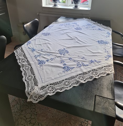 Tablecloth beautifully embroidered with blue flowers 150 x 150 cm.