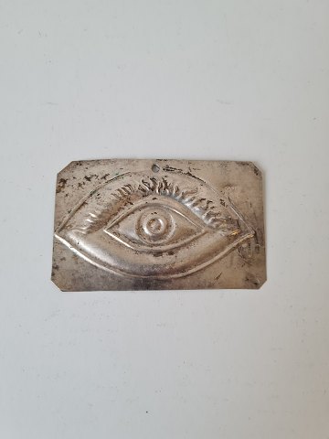 Votive in silver with motif of an eye