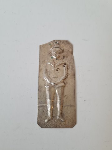 Votive in silver with motif of a boy