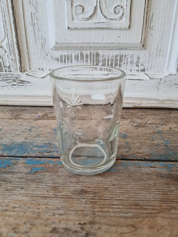 Water glass decorated with moon and stars made of pressed glass