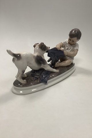 Dahl Jensen Figurine of wire haired Foxterrier dog in play with boy No 1072
