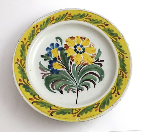 Kellinghusen plate, faience. Plate with floral motif. Diameter 23 cm. With 
repair.
