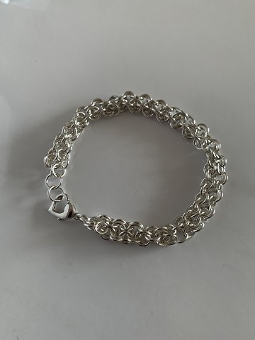 Sterling silver bracelet, 19.5 centimeters long, with heart clasp.