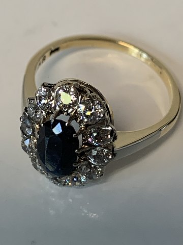 Gold ring in 14 carats, with diamonds and blue sapphire. Size 56.