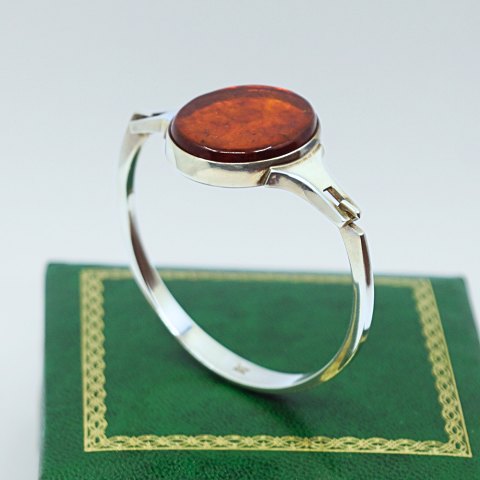 N. E. From; Bangle of sterling silver with amber