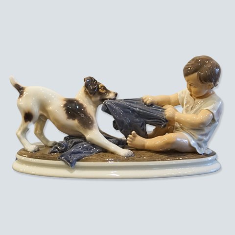 Dahl Jensen; Porcelain figurine of boy and dog No. 1072