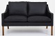 Børge Mogensen / Fredericia Furniture
BM 2208 - Reupholstered 2-seater sofa in black Klassik leather and legs in 
mahogany. KLASSIK offers upholstery of the sofa in fabric or leather of your 
choice.
Availability: 6-8 weeks
Renovated
