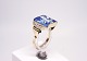 Ring of 14 ct. gold decorated with small clear stones and a large topaz.
5000m2 showroom.