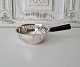 Silver saucepan with handle in black lacquered wood