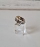 Regitze Overgaard for Georg Jensen Magic Doppio ring in 18 kt white and red gold 
with diamonds totaling 0.06 ct