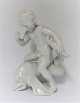 Bing & Grondahl. Porzellanfigur. Kai Nielsen. Seekind auf Delphin, blanc de 
chine. Höhe 18 cm. (1 Wahl)