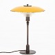 Poul Henningsen / Louis Poulsen
PH 3,5/2 - Bordlampe i bruneret messing med gul kobberskærm og matglas-skærme. 
Mærket 