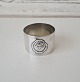 Wide silver napkin ring decorated with roses