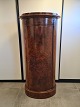 Oval pedestal cabinet in mahogany