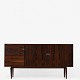 H. W. Klein / Bramin Møbelfabrik 
Tall rosewood sideboard with drawers and tambour doors.
1 pc. in stock
Good condition
