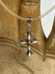Vintage silver cross with transparent natural rubber "chain" and silver clasp.