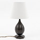 Just Andersen / Own workshop
Table lamp in patinated metal with light shade.
1 pc. in stock
Good, used condition
