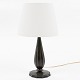 Just Andersen / Own workshop
Table lamp in patinated metal with light shade.
1 pc. in stock
Good, used condition
