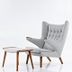 Hans J. Wegner / AP Chair
AP 19 - Reupholstered Teddy chair with matching stool in light grey textile 
(Hallingdal 65 wool, colour code: 110).
ABOUT THE FURNITURE: This is an original 