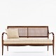 Frits Henningsen / Frits Henningsen
Sofa in mahogany with curved arms and patinated French cane.
1 pc. in stock
Good, used condition
