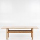 Hans J. Wegner / Andreas Tuck
AT 10 - Coffee table in solid oak with shelf in wicker. Manufacturer