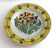Kellinghusen plate, faience. Deep plate with floral motif. Diameter 23 cm. With 
repair.