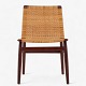 Jørgen Høj / Thorald Madsen.
Chair in solid teak with seat and back in originally upholstered wicker. 
Designed in 1951. Labelled from manufacturer.
1 pc. in stock
