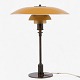 Poul Henningsen / Louis Poulsen
PH 3.5/2 - Table lamp in burnished brass with upper shade in yellow-lacquered 
copper and middle and lower shade in amber glass. Stamped 