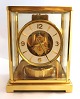 Jaeger LeCoultre. Atmos. Table clock in brass case with glass sides. Height 22.3 
cm