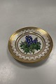Royal Copenhagen Antique Plate with Flower Motif and gold. Signed by Christian  Klein from 1820-1850