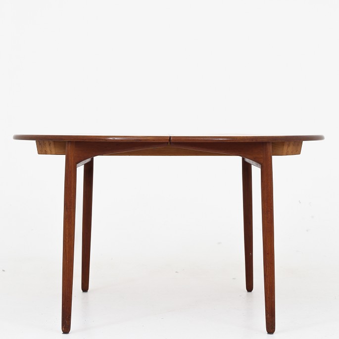 Ejner Larsen & Aksel Bender Madsen / Willy Beck
Round dining table in teak with three additional plates. Label from master 
cabinetmaker.
1 pc. in stock
Good, used condition
