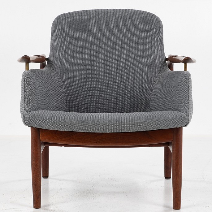 Finn Juhl / Niels Vodder
NV 53 - Rare armchair in solid teak with dark gray textile. Stamped by the 
carpenter. Designed in 1953.
1 pc. in stock
Good condition
