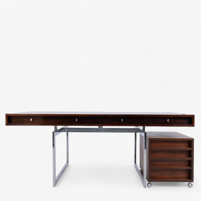 Bodil Kjær / E. Pedersen & Son.
Rare freestanding desk in Brazilian rosewood with four drawers and drawer 
module on castors. Key included. Label from manufacturer.
1 pc. in stock
